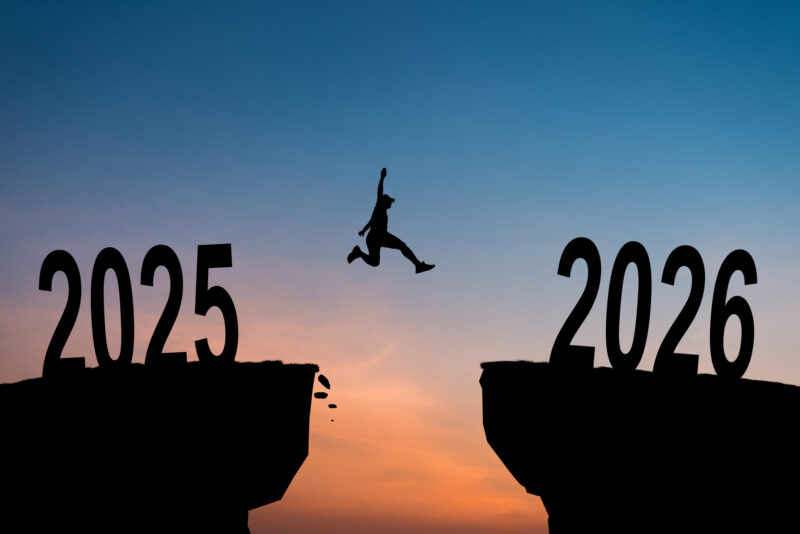Silhouette of man and woman jumping over a cliff with 2025 year to 2026 year, concept for success new year. Vector illustration